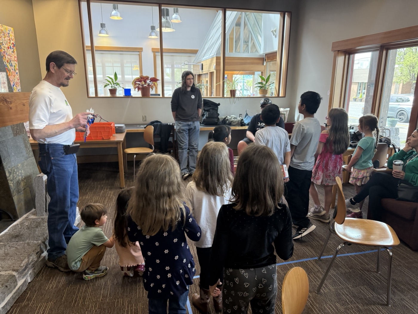 PioBytes members demonstrating robots at the community library